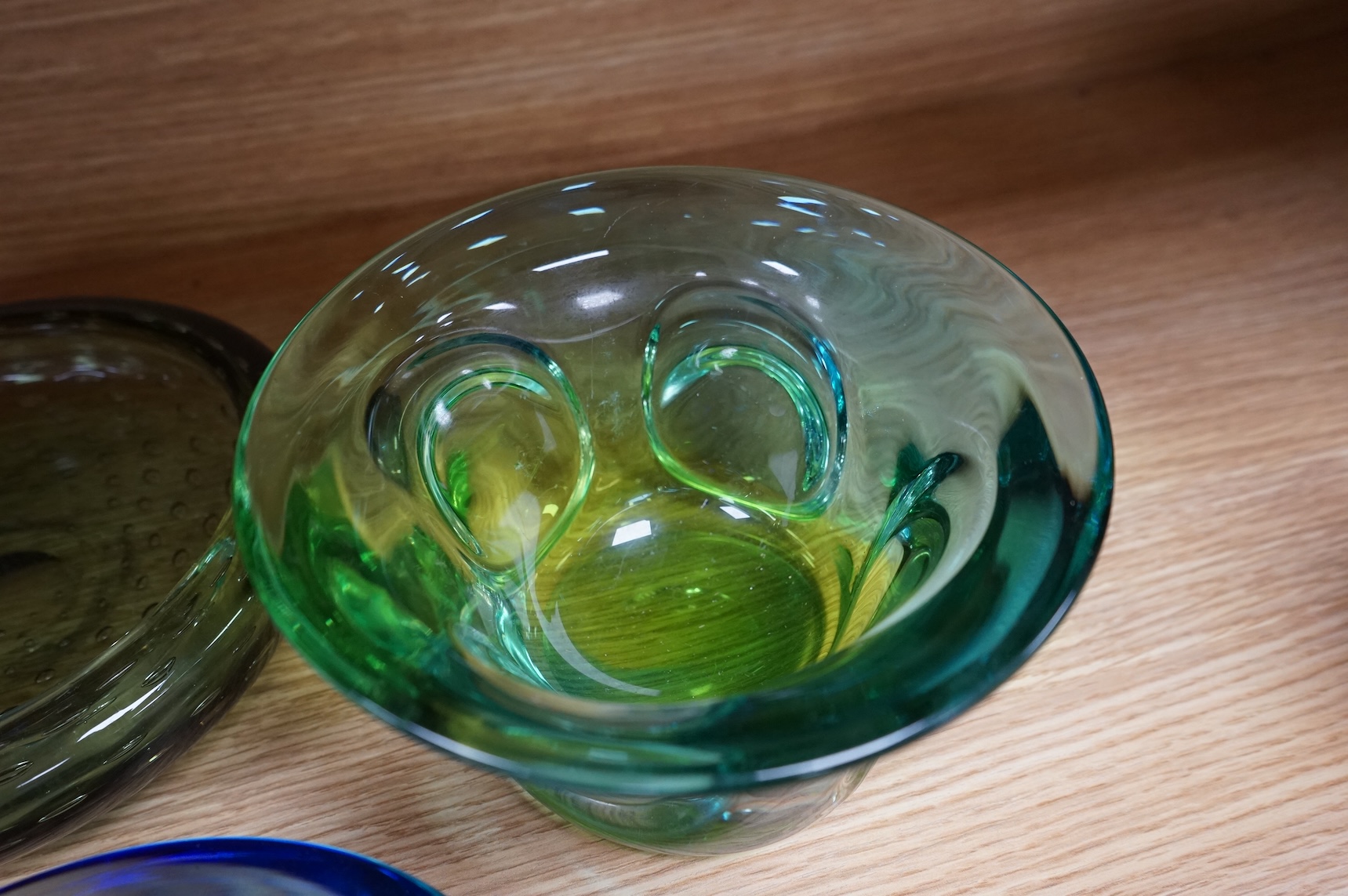 A Whitefriars green glass ‘bubble’ dish, a Costa Boda blue/green bowl and a Murano dish (3) tallest 10.5cm